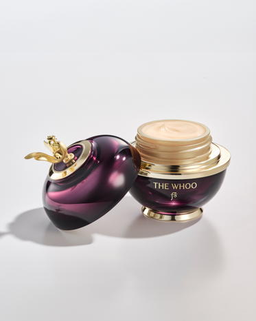 THE WHOO Imperial Youth Contour Eye Cream is opened and showing its cream texture inside, with a white background, featuring the 'THE WHOO' logo.