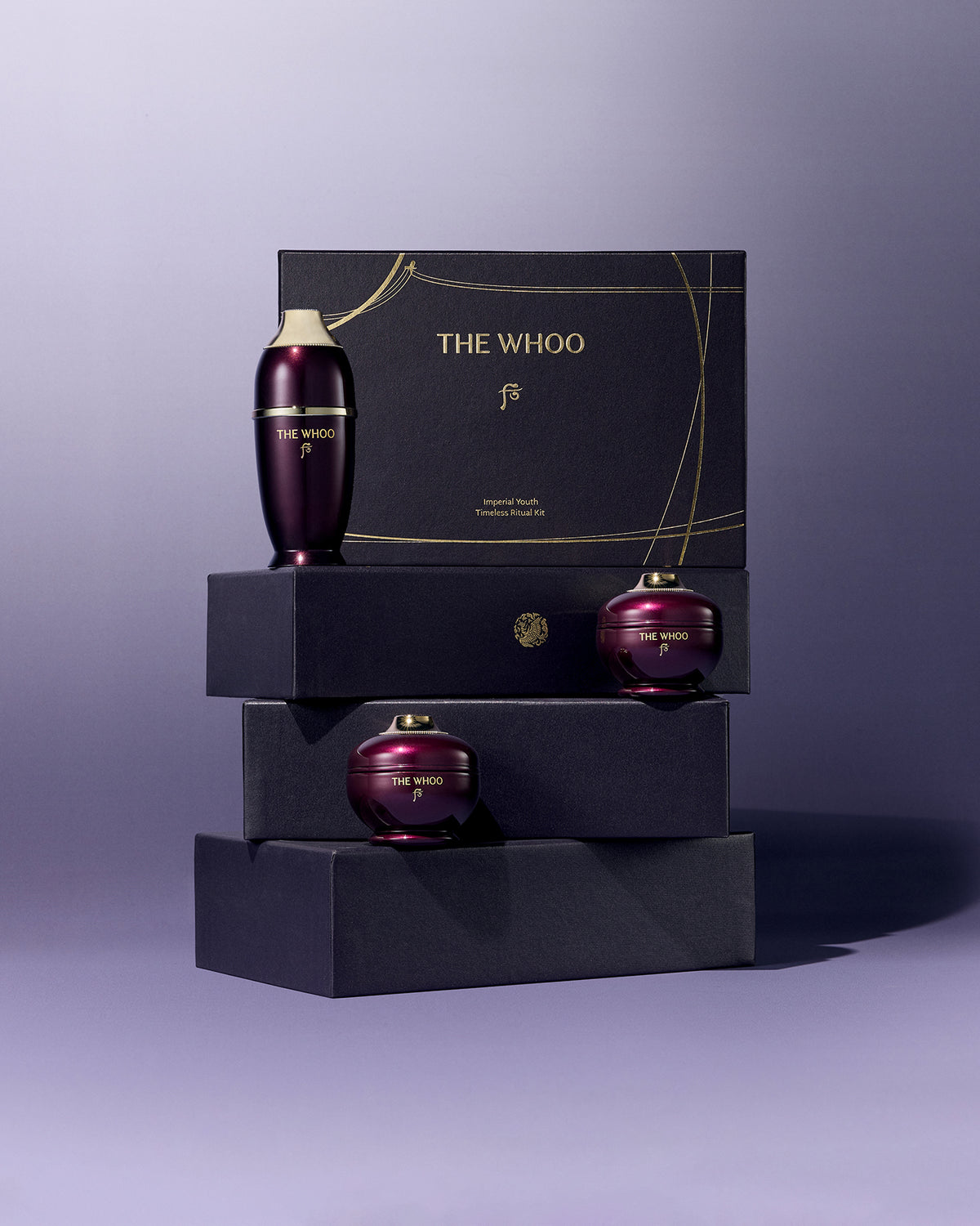 THE WHOO Imperial Youth collection travel-size set, including the Concentrate Serum, Cream, and Contour Eye Cream minis on a soft mint-green fabric.