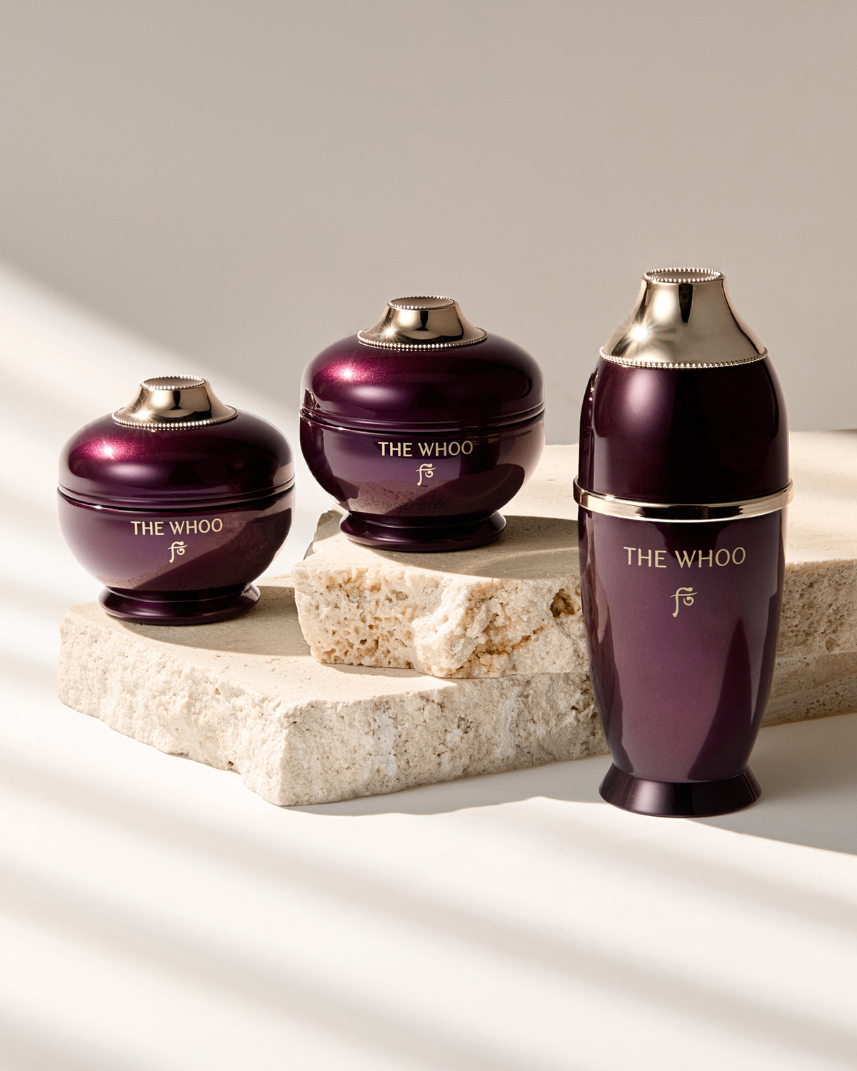 THE WHOO Imperial Youth collection travel-size set, including the Concentrate Serum, Cream, and Contour Eye Cream minis on a soft mint-green fabric.